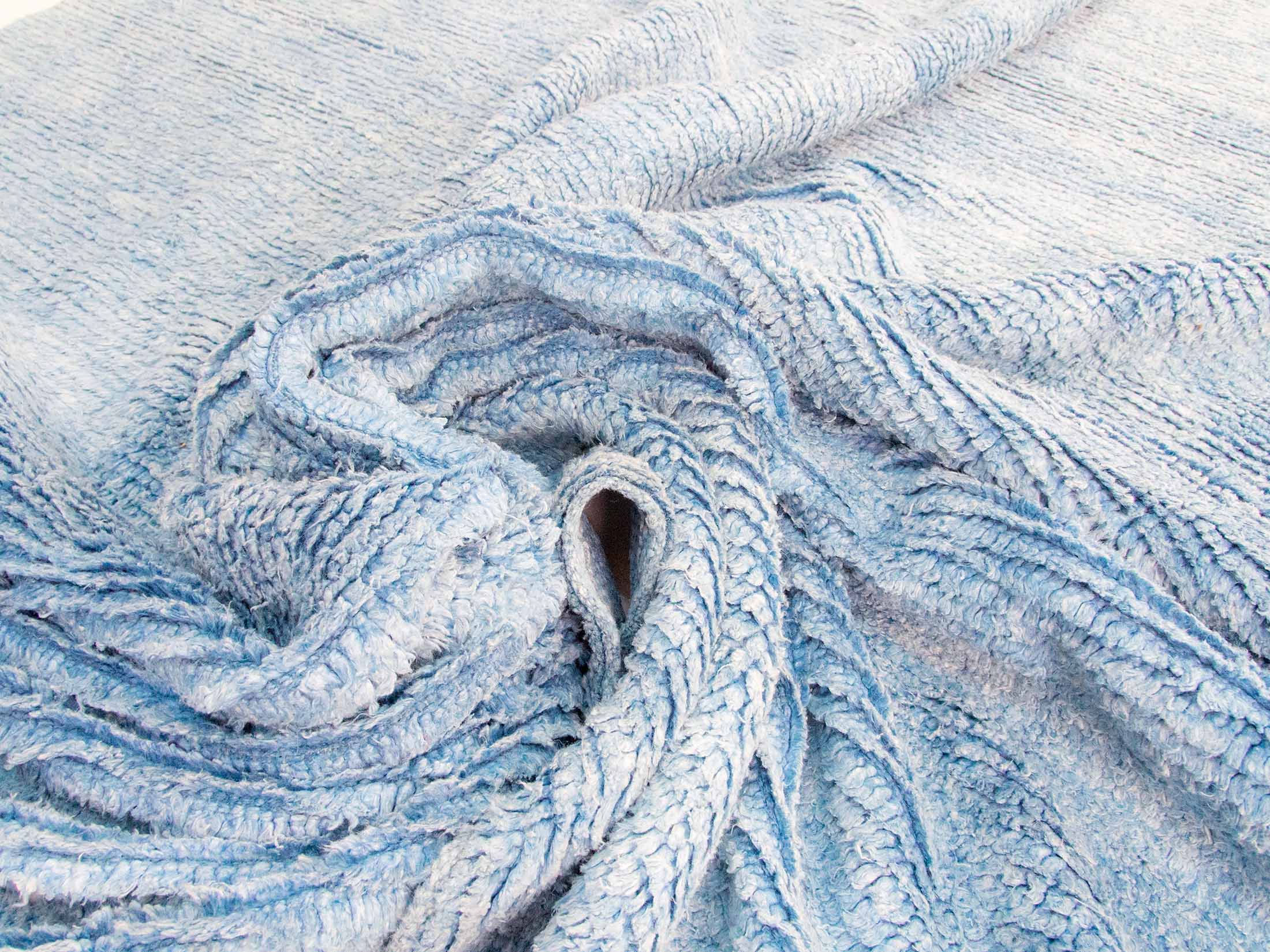 blue solid color hemp pompom rug