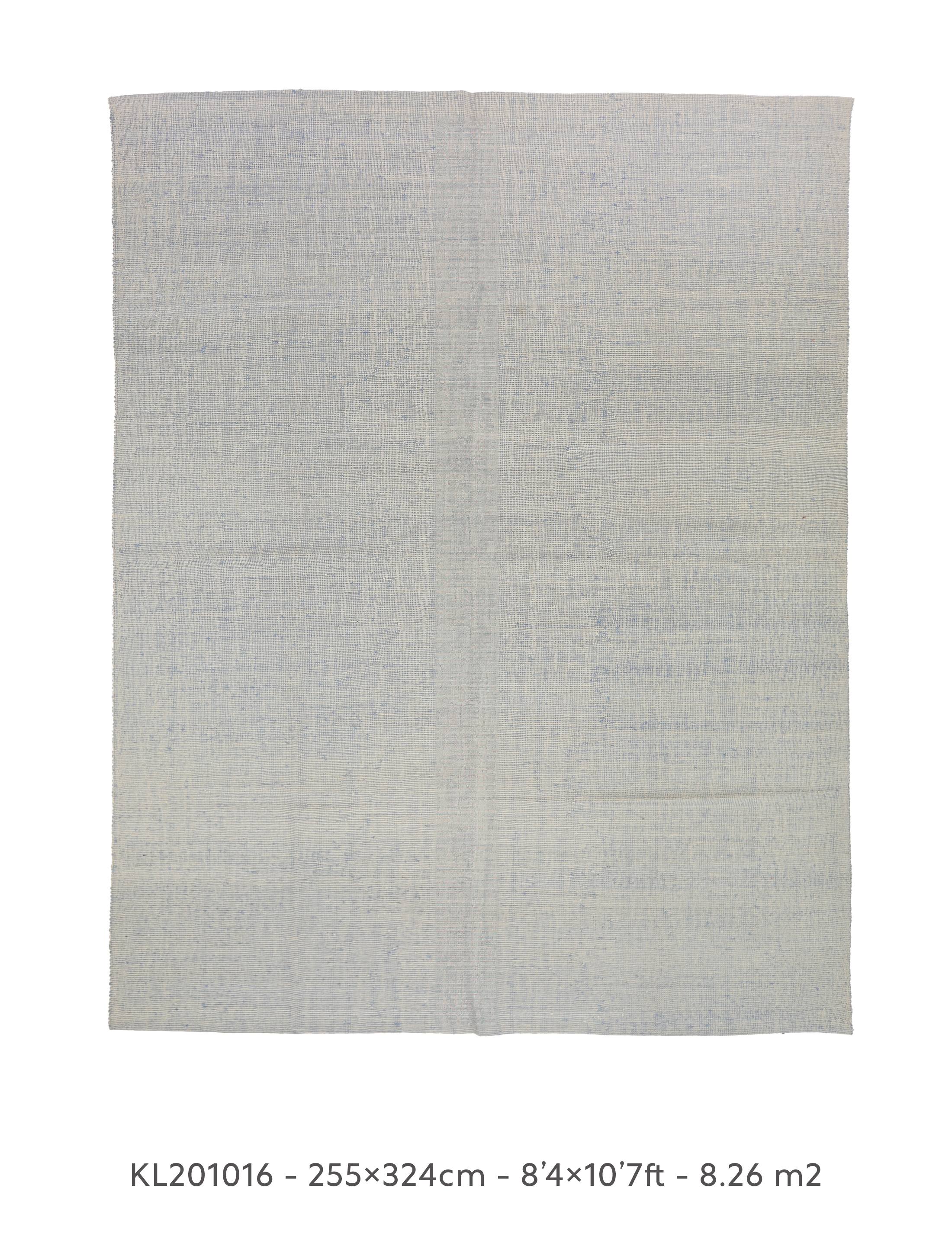 tight, intricate weave with subtle variations in color, including shades of grey and hints of blue