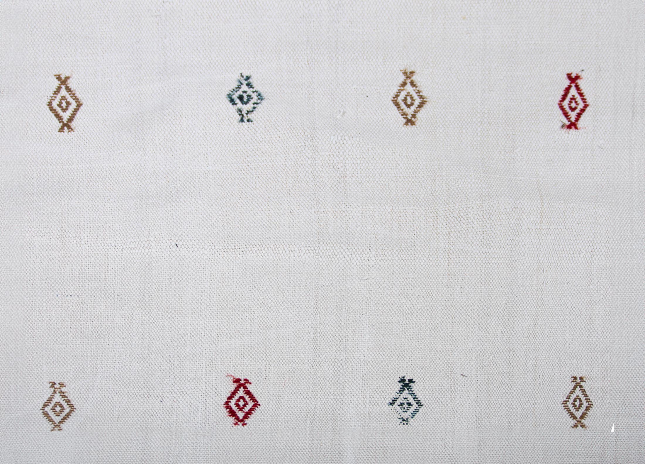 white cotton runner kilim rug with embroidered arcahic patterns