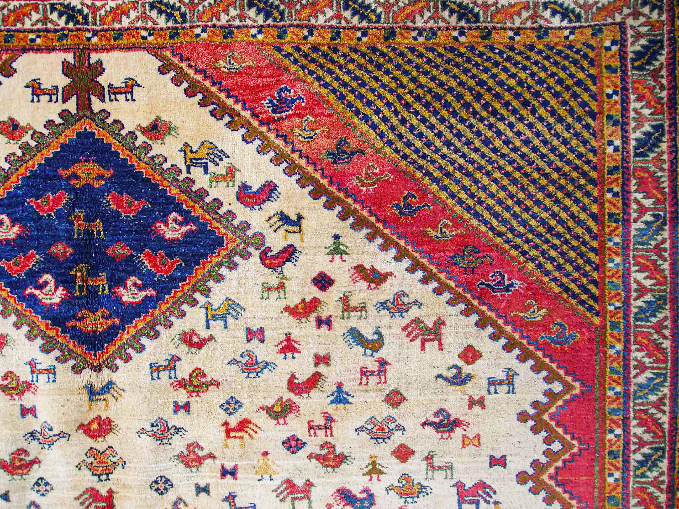 hand knotted Turkish unusual rug with archaic motif